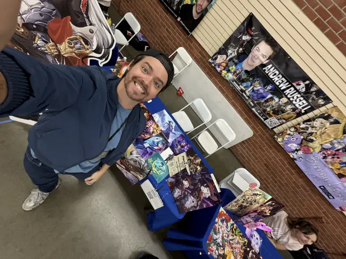 Andrew Russell greeting attendees from his convention booth