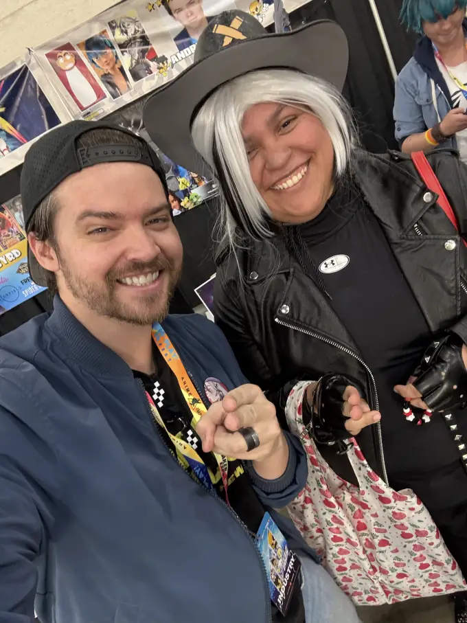 Andrew Russell sharing a playful selfie with a costumed fan