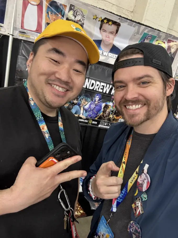 Andrew Russell taking a fan selfie beside his autograph table