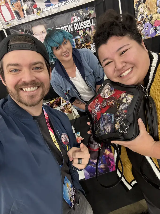 Andrew Russell with a smiling fan during a convention appearance