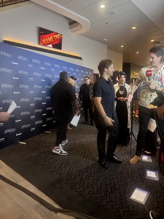 Andrew Russell greeting attendees near a convention press line