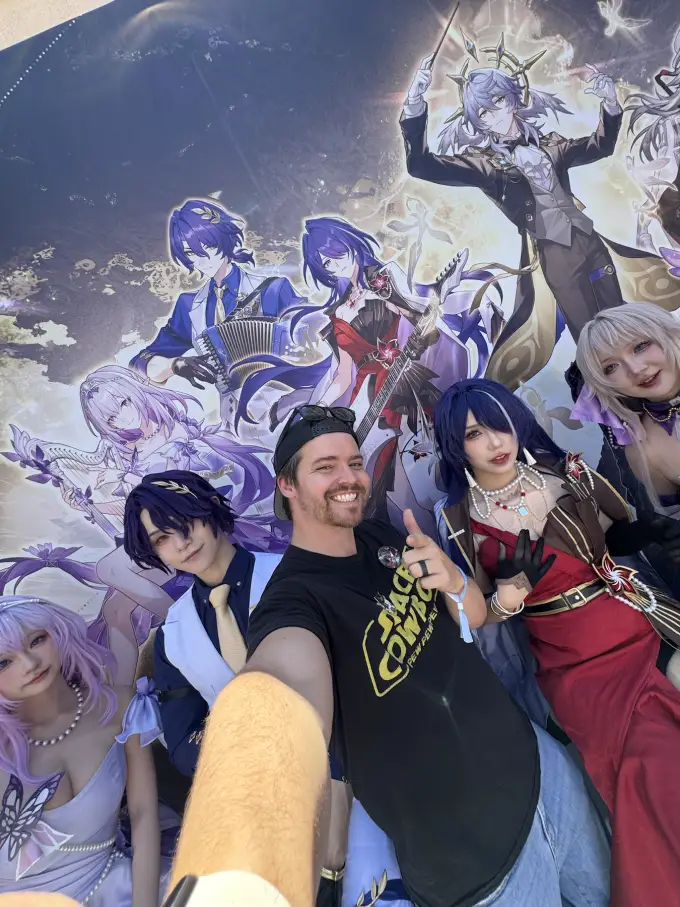 Andrew Russell with a group of cosplayers at a fan event