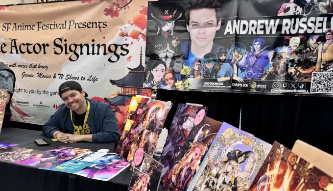 Andrew Russell at a staffed convention signing table