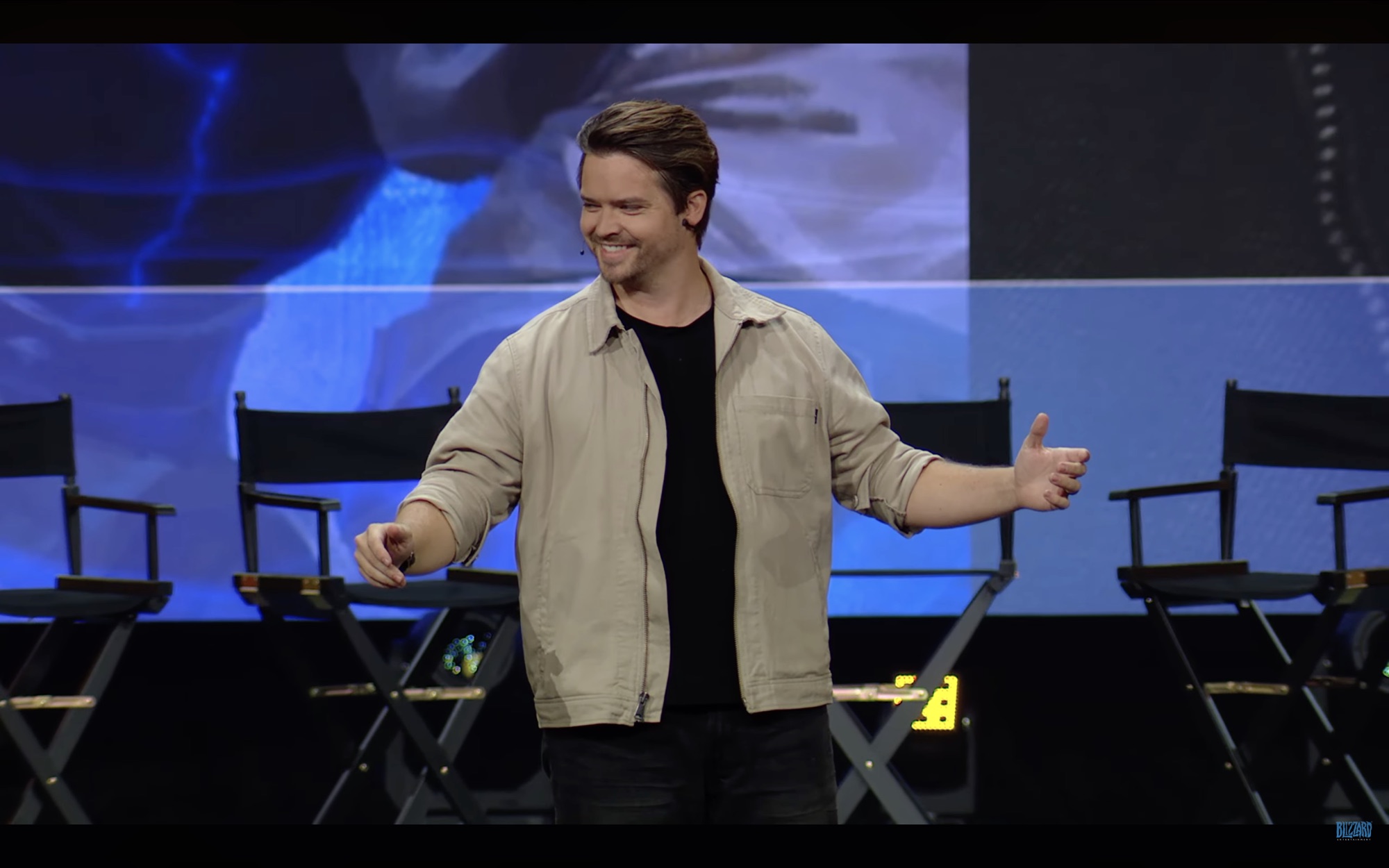 Andrew Russell smiling on the BlizzCon Main Stage